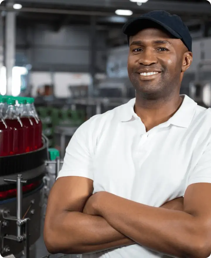 A smiling worker on the processing floor